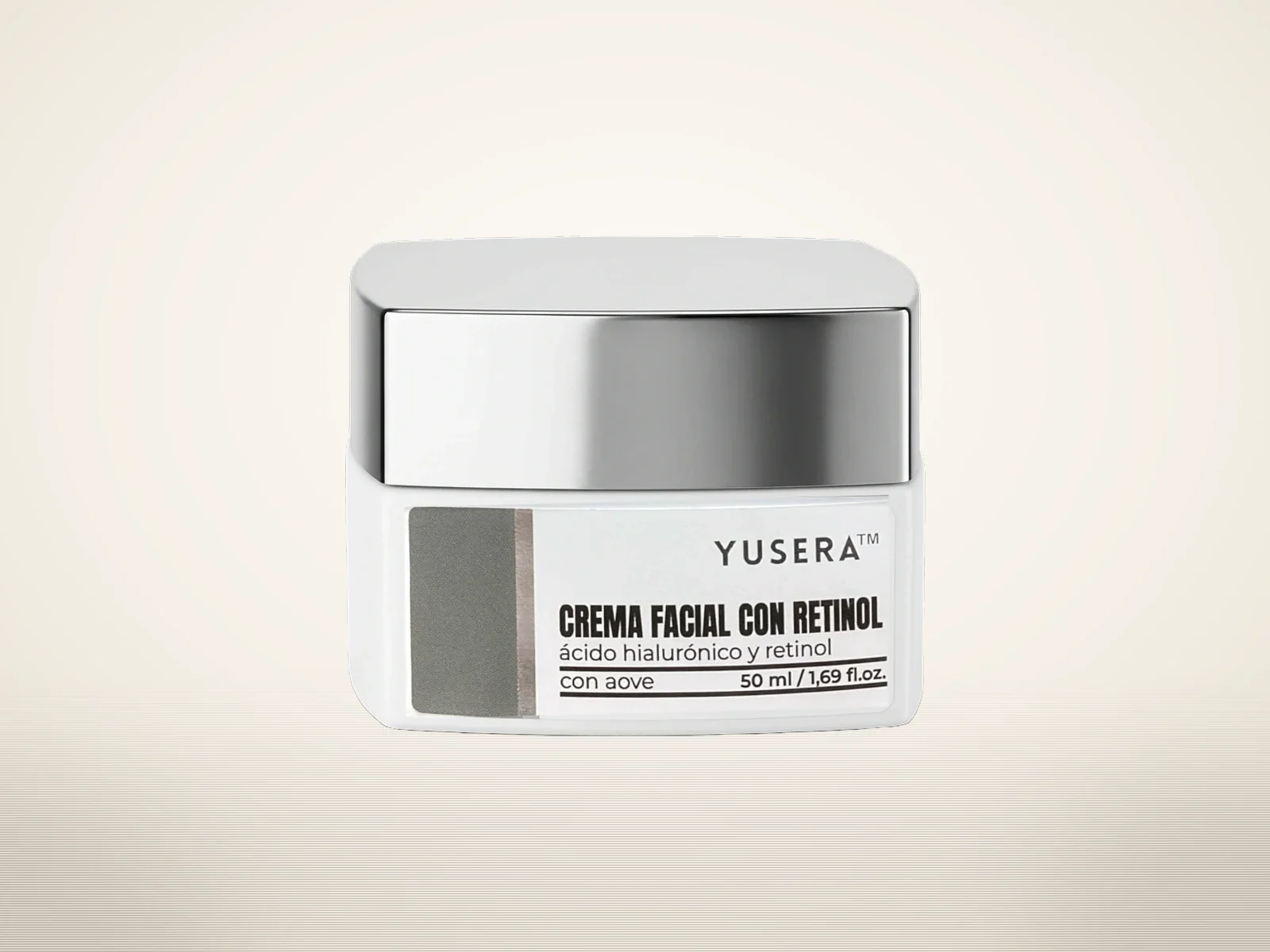 Crema Facial con Retinol de Yusera, tarro blanco con tapa plateada, sobre fondo claro